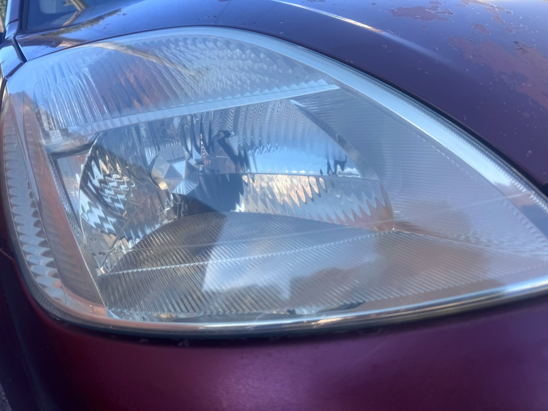 Restored headlight lens — yellow haze and micro-scratches eliminated